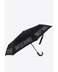 Moschino - Logo Print Folding Umbrella - Lyst