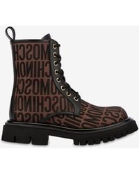 Moschino - All-Over Logo Combat Boots - Lyst