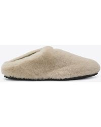 Prada - Triangle Logo Shearling Flat Mules - Lyst
