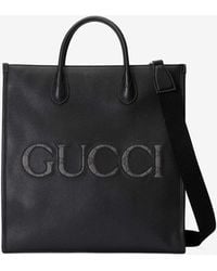 Gucci - Embossed Logo Top Handle Bag - Lyst