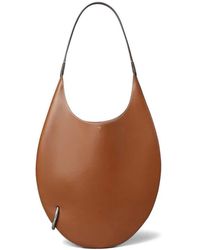 Tory Burch - Pierced Soft Shoulder Bag - Lyst