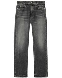 Versace - Jeans With Logo Appliqué - Lyst