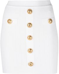Balmain - Embossed-Buttons Knit Mini Skirt - Lyst