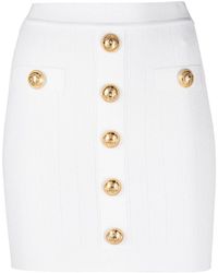 Balmain - Embossed-Buttons Knit Mini Skirt - Lyst
