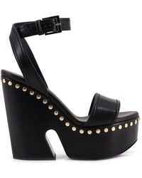 Givenchy - Studded Leather Wedge Sandals - Lyst