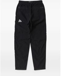 and wander - Pleated Belted Trousers - Lyst