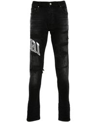 Amiri - Varsity Logo Repair Jeans - Lyst