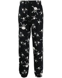 SAINT Mxxxxxx - Skull-Print Cotton Track Pants - Lyst