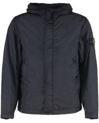 Stone Island - Giacca in tessuto tecnico con zip e cappuccio - Lyst