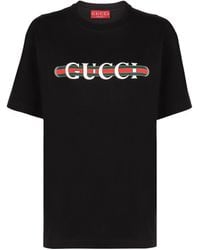 Gucci - Magliette nera in cotone con stampa logo - Lyst