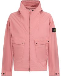 Stone Island - Giacca leggera rosa con cappuccio regolabile - Lyst