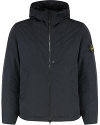 Stone Island - Giacca in tessuto tecnico con zip e cappuccio - Lyst