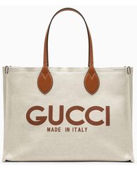 Gucci - Borsa tote grande beige in canvas con logo - Lyst