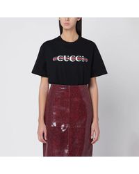 Gucci - T-shirt nera con stampa logo - Lyst