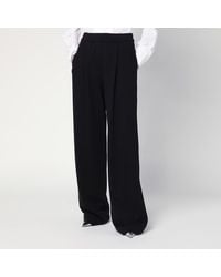 Dries Van Noten - Pantaloni ampi neri in cotone - Lyst