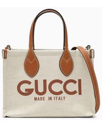 Gucci - Borsa tote piccola beige in canvas con logo - Lyst