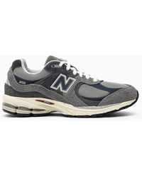 New Balance - Sneaker bassa m2002rel grigia/blu - Lyst