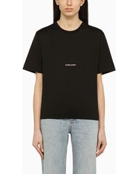 Saint Laurent - T-shirt girocollo nera con stampa logo - Lyst