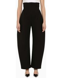 Alaïa - Wool-blend Rounded Corset Trousers - Lyst