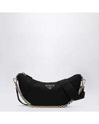 Prada - Borsa a spalla demi-lune nera in re-nylon - Lyst