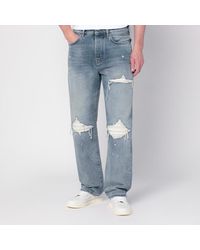 Amiri - Jeans con strappi antique indigo - Lyst