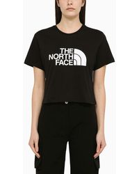 The North Face - T-shirt cropped nera in cotone con logo - Lyst