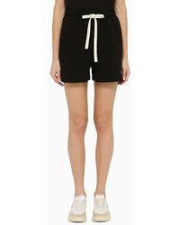 Palm Angels - Shorts neri con logo in cotone - Lyst