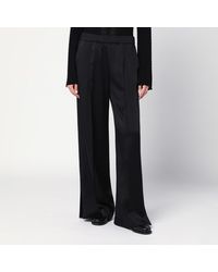 Jil Sander - Pantalone a palazzo neri in satin - Lyst