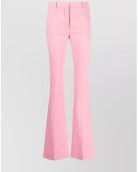 Versace - Virgin Wool High-Rise Logo-Print Flared Trousers - Lyst