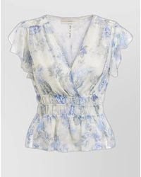 Guess - V Neck Peplum Top Ruffle Floral Design - Lyst