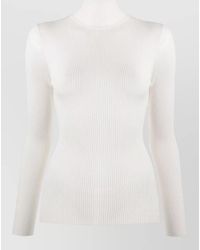 Wolford - Virgin Wool Ribbed Turtleneck Long Sleeve Top - Lyst