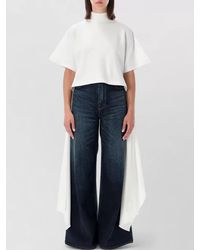 Alaïa - Cotton Jersey Ribbed Mock Neck Asymmetric Long-Sleeve Blouse - Lyst