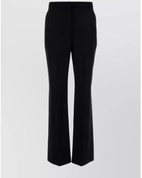 Givenchy - Wool Flared Wide-Leg Trousers - Lyst
