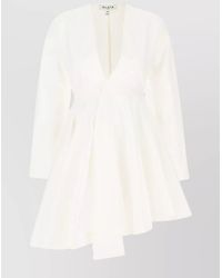 Alaïa - Cotton Asymmetric V-Neck Long-Sleeve Mini Dress - Lyst