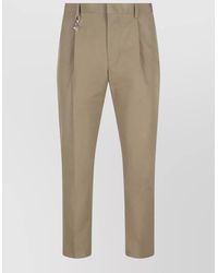 Prada - Pleated Cotton Trousers With Charm - Lyst