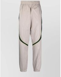 Givenchy - Calf Leather Relaxed-Fit Tapered Track Pants - Lyst