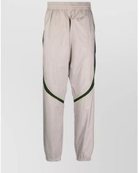 Givenchy - Calf Leather Relaxed-Fit Tapered Track Pants - Lyst