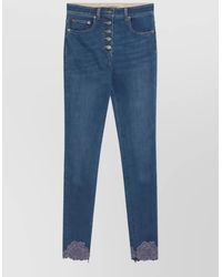 Valentino - High-Rise Slim-Fit Lace-Trim Denim Jeans - Lyst