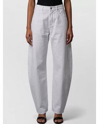 Alaïa - Rodeo Mid Rise Wide Leg Denim Trousers - Lyst