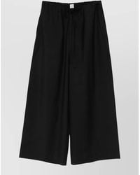 TOTEME - Wool Drawstring Wide-Leg Trousers - Lyst