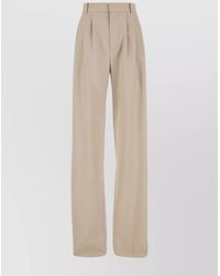 Saint Laurent - Wool Mid-Rise Pleated Wide-Leg Trousers - Lyst