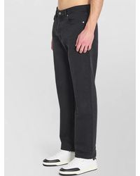 Saint Laurent - Cotton Mid-Rise Straight-Leg Denim Trousers - Lyst