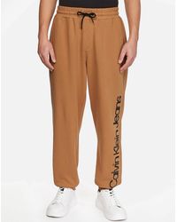 Calvin Klein - Logo-printed Cotton Pants - Lyst