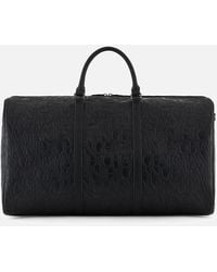 Armani Exchange - Allover Logo Recycled Duffle Bag - Lyst