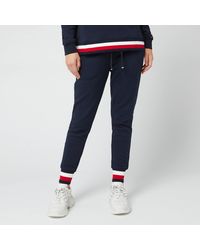 Tommy Hilfiger Track pants and sweatpants for Up to 60% off at Lyst.com