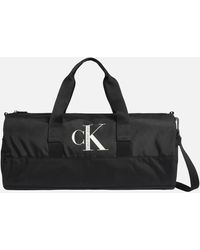 Mens Bags Duffel bags and weekend bags Calvin Klein Sport Essential Duffle Inst Crossovers in Black for Men 