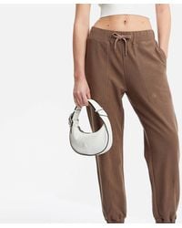 Calvin Klein - Crescent Faux Leather Bag - Lyst