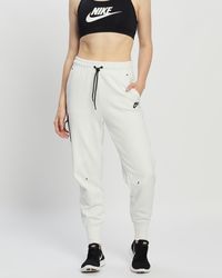 pink nike tech pants
