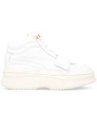 puma defy mid varsity white