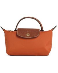 Longchamp Le Pliage Original Clutch Bag in Black | Lyst